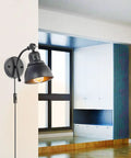 Set Of 2 Black Plug In Wall Sconces Industrial Style With On Off Cord Switch mounted in modern living room.