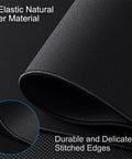 Close-up of black XXL Large Gaming Mouse Pad 31.5 by 15.7 Inch Extended Desk Mat with stitched edges and micro weave cloth