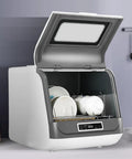 Smooth Operator Countertop Dishwasher With Three Reliable Wash Cycles Heated Dry Setting And Rotating Spray For Sparkling Dishes, open with clean dishes inside.