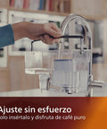 Person installing AquaClean Calc And Water Filter For Your Coffee Maker Keeps Descale At Bay For Up To 5,000 Cups Reduces Limescale Build Up Micro Porous Filtration Includes 2 Filters Compatible under a kitchen tap.