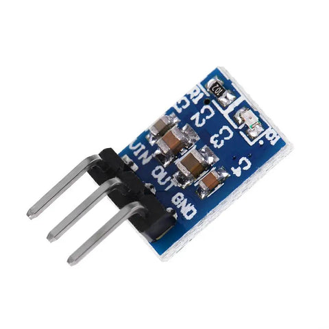 Close-up of single AMS1117 3.3V voltage regulator module with pins, part of Ten Pack AMS1117 3.3V Voltage Regulator Module Buck Converter 4.75V to 12V Input 3.3V Output 0.8A Ideal For Microcontroller Projects DIY Arduino Prototyping