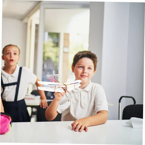 Child holding model plane with 5 Piece RC Airplane Propeller Blades Rad High Performance Rubber Band Powered Gear for Model Planes Easy Install