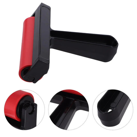 Solid Grip Rubber Paint Roller For Printmaking And Classroom Art Projects Sporting A Clean Minimalist Frame view from the side with red roller and black handle.