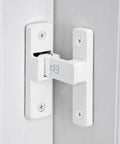 Close-up view of White 90 Degree Barn Door Lock With Right Angle Slide Latch For Sliding Wood Panels installed on a door.