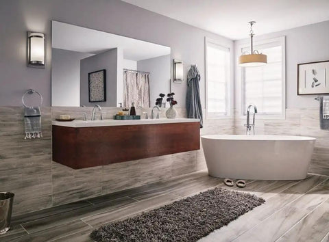 Bathroom with contemporary design featuring freestanding tub and vanity, pendant light not visible; modern fixtures and decor.
