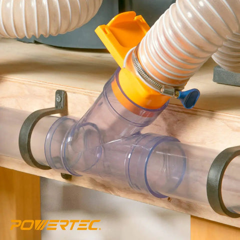 No Sweat Pvc Dust Collection Y Fitting 2 1/2 Inch Id connects 2 1/2 Inch Od Pipe fast with built in coupler visible on workshop table.