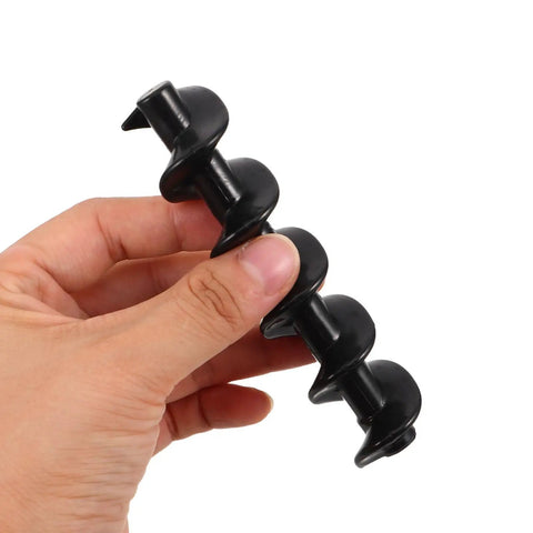 Hand holding black Spiral Shaft Replacement Kit For Chocolate Fountain 4pcs Feed Rods For Home And Small Business Fondue Machines