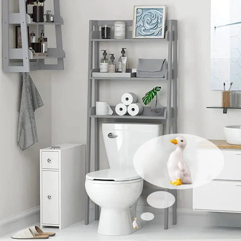 Duck Themed Toilet Bolt Covers Set Ceramic Duck Screw Caps installed on white toilet in bathroom with shelves and decor.
