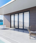 Premium Aluminum Bifold Door 120X96 Black With Four Low E Tempered Glass Panels on modern patio with ocean view.