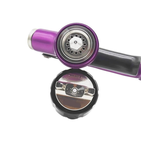 Close-up of the nozzle and cap of Badass Gold Auto Spray Gun With Heavy Duty 360 Degree Swivel Air Hose Connector And Precision 1.3 Nozzle.