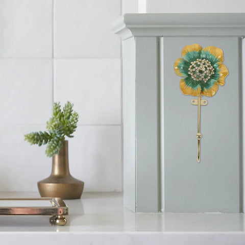 Sweet Vintage Flower Wall Hooks That Are Dang Handy For Hanging Coats Keys And Kitchen Towels Without Taking Up Valuable Space Plus The Rustic Design Looks Totally Legit In Any Room mounted on a wall with a flower design.