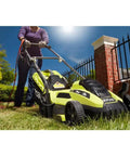 Corded Electric Walk-Behind Lawn Mower With 11 Amp Power, Lightweight Push Design For Easy Yard Work, 13 Inch Cutting Width, No Gas, Quiet, Efficient For Small To Medium Lawns, used on a grassy yard