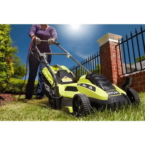 Corded Electric Walk-Behind Lawn Mower With 11 Amp Power, Lightweight Push Design For Easy Yard Work, 13 Inch Cutting Width, No Gas, Quiet, Efficient For Small To Medium Lawns, used on a grassy yard