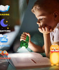 Child reading with green animal flashlight from 4 Pack Tiny Animal LED Flashlights For Kids 2 In 1 Camping Lantern And Flashlight