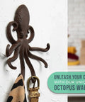 Rad Cast Iron Octopus Wall Hook Rustic Brown Antique Finish Sculpted Tentacles holding a scarf against a textured wall.