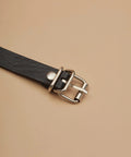 Close-up of the buckle on the Badass Black Pu Leather Waist Chain Belt Featuring Heavy Duty Hardware And Distressed Details.