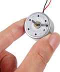 10 Pack Dope Mini DC Motors 3V To 12V For DIY Toys And Electronics Projects held between fingers showcasing size