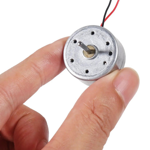 10 Pack Dope Mini DC Motors 3V To 12V For DIY Toys And Electronics Projects held between fingers showcasing size