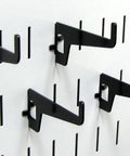 Long Reach Pegboard Hook Pack, 2 7/8 Inch Metal Hooks for Slotted Tool Boards, Black Finish, four hooks on a pegboard