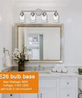 4 Light Vanity Lights In Brushed Nickel Finish With Hammered Glass Shades installed over bathroom mirror; E26 bulb base detail