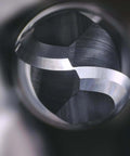 Ball-nose carbide end mill, 1/8 in shank, metal finish, close-up inside a tool chuck