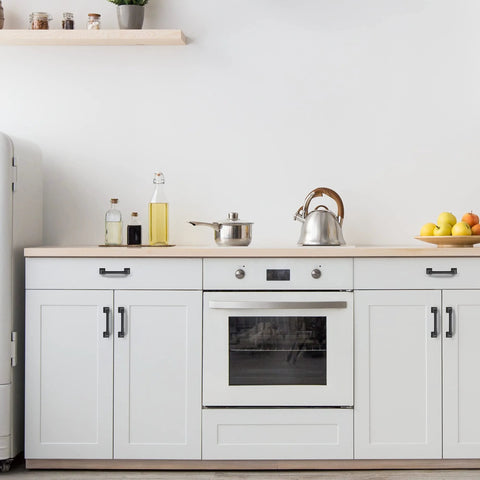 Modern kitchen with matte black kitchen cabinet handles set of 10, 4-3/4 inch length, 3-3/4 inch hole centers on white cabinets.