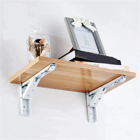 Heavy Duty Folding Shelf Brackets 2 Pack Stainless Steel Collapsible Wall Mounts Built Tough As Nails Silver 14 Inch shelf with books.