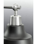 Close-up of Bramlett Bath And Vanity Light in Nickel Finish, showcasing industrial design details and durable material.