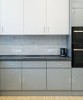 Modern kitchen with 30 Pack 4 Inch Brushed Nickel Cabinet Pulls Square Handles installed on white cabinets with stainless steel appliances.