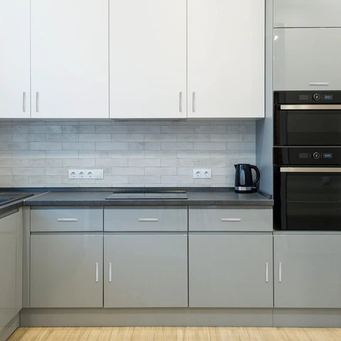 Modern kitchen with 30 Pack 4 Inch Brushed Nickel Cabinet Pulls Square Handles installed on white cabinets with stainless steel appliances.