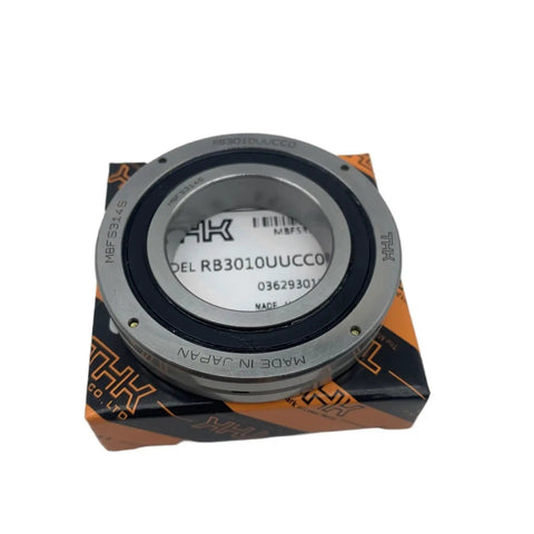 Precision Cross Roller Ring RB3010 And RB3010UUCC0C0 Heavy Duty Rotary Table Bearing displayed on packaging, showing smooth surface.