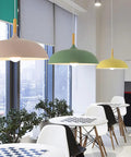 Modern Nordic Style Hanging Lamp Fixture Featuring Solid Wood Accents And Durable Iron Base Super Sleek Green Metal Shade for dining setup.