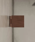 Side view of Adjustable Square Glass To Wall Clip With Solid Forged Brass Construction And Antique Copper Finish Backplate Two Inches By Two Inches Faceplate Two Inches By Two Inches Compatible With Three Eighths And One Half Inch Glass Panels For Frameless Showers.