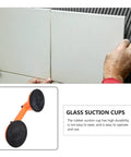 Person using Heavy Duty Glass Suction Cup Vacuum Lifter Tool With Dual Grippers for large tile installation.