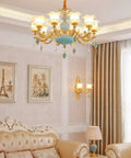 Next Level Modern Chandelier With Bold Adjustable Design And Sparkling Crystal Glass Accents Bright 15 Light Led Ceiling Pendant in gold blue zinc finish.