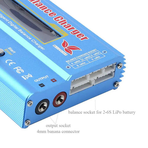 Close-up of B6 Mini Multi Functional Balance Charger Discharger showing output sockets and charging ports for LiPo batteries.