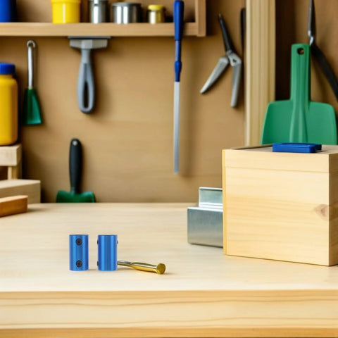 Two Ten Piece Blue Aluminum Motor Shaft Coupling Connectors 6mm with installation tool on wooden workbench.