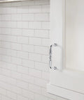 3 Inch Center To Center Polished Chrome Everyday Heritage Cabinet Pull installed on white kitchen cabinet