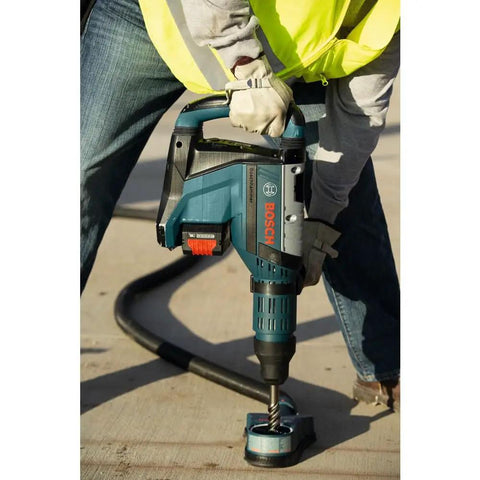 Worker using SDS Max Speed Xtreme Rotary Hammer Bit With 100 Percent Carbide Head Four Cutter Design on concrete surface