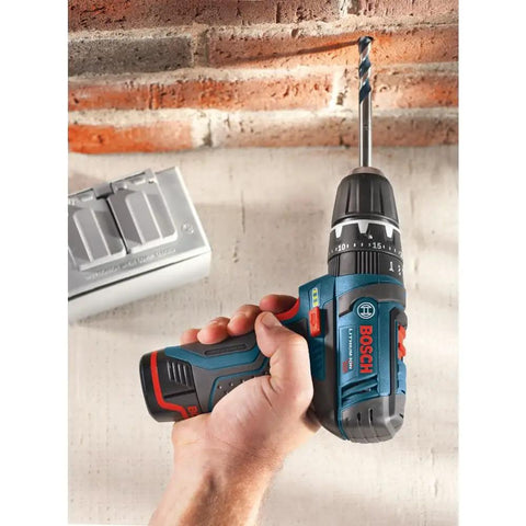 Person using Ultra Compact 12V Max Hammer Drill And Driver Kit with 3/8 Inch Auto Chuck on brick wall, showcasing two speed control