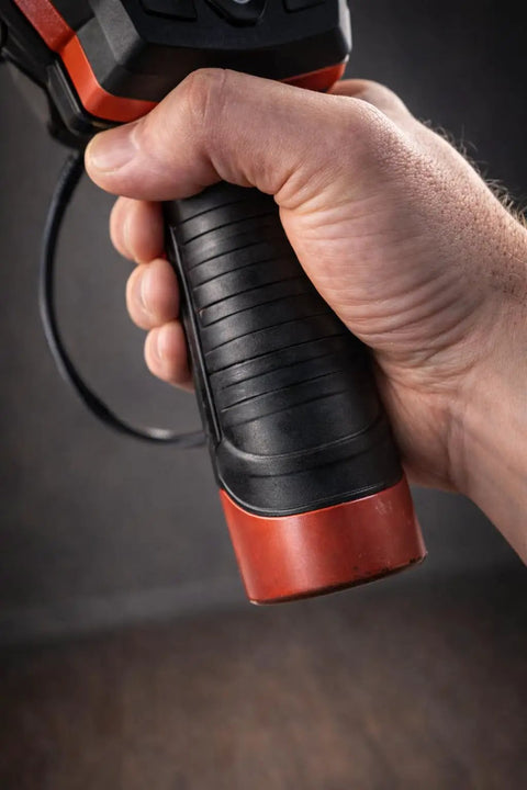 Close-up of hand gripping handle of Clear View Borescope With 2.4 Inch LCD Screen And 8.5mm Waterproof Camera 38 Inch Flexible Cable