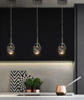 Teardrop Crystal Pendant Light In Black Dimmable LED Bubble Ceiling Fixture With Adjustable Metal Rods in modern kitchen setting
