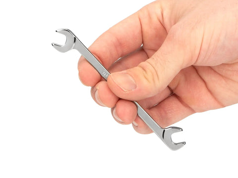 Quarter Inch Angle Head Open End Wrench With 30 60 Degree Angled Head Built For Unmatched Access In Confined Or Tight Spots Slim Beam For Clear Line Of Sight Made In USA Model WAE83006 held in hand