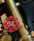 Close-up of Red 7x7mm Gate Valve Shutoff Handles Set For Industrial Valve Control on machinery, highlighting flat bottom design.