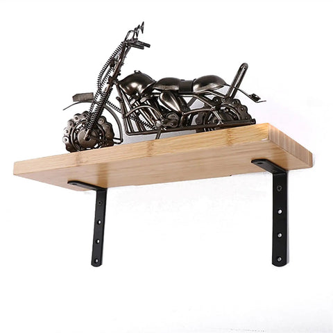 Hella Sturdy Thickened Black Steel L Shaped Corner Braces Heavy Duty 90 Degree Right Angle Shelf Supports Pack Of Twelve With Durable Coating holding a wood shelf.