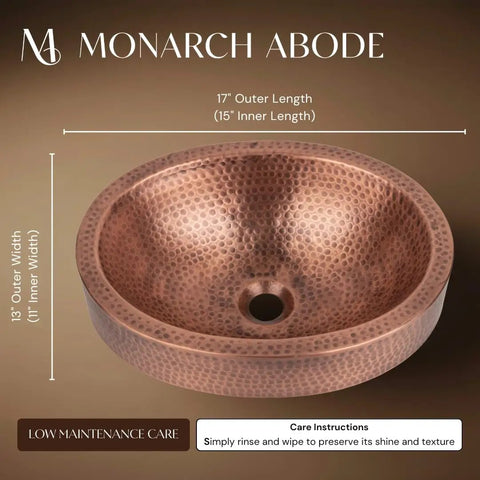 Hand Hammered 17-Inch Oval Skirted Drop-In Copper Bathroom Sink For Vanity Countertop, top view showing hand-hammered texture.
