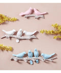 Chic Five Hook Wall Mounted Coat Rack With A Cool Blue Bird Vibe featuring colorful bird designs on branches for decorative storage.