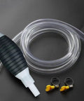 Heavy Duty Liquid Sucker Hand Pump With Large Bore Ball Valves And High Flow Hoses For Super Efficient Fluid Transfer From Tanks To Cars Or Jugs Without Any Filter Issues, featuring flexible clear hoses and rubber bulb.