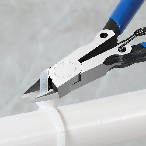 Precision flush cutters cutting white plastic, featuring blue handles, ideal for electronics and DIY projects up to 14 gauge copper.