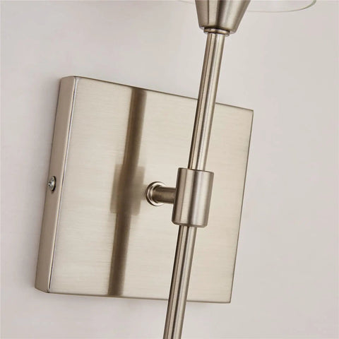Close-up of Brushed Nickel Wall Sconces Set Of 2 Sleek Modern Industrial Vanity Lights With Clear Glass Shades for Bathroom fixtures
